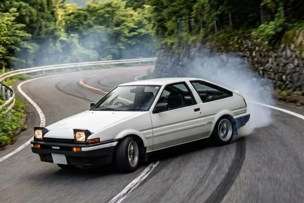 Toyota AE86 Trueno drifting on a mountain road